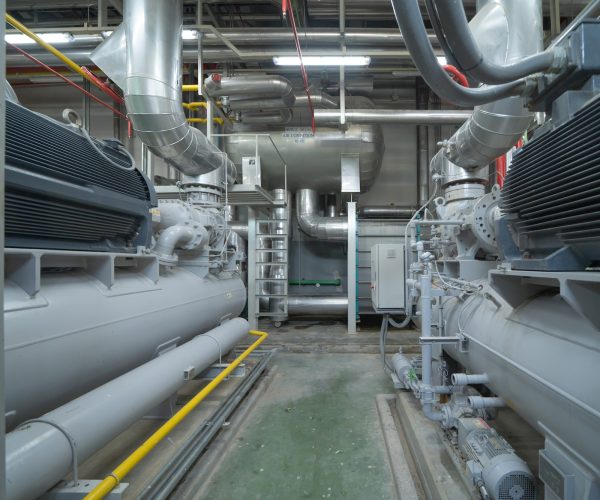 Industry factory. Cooling tower in building. System work machine. Water Supply and return pipe lines