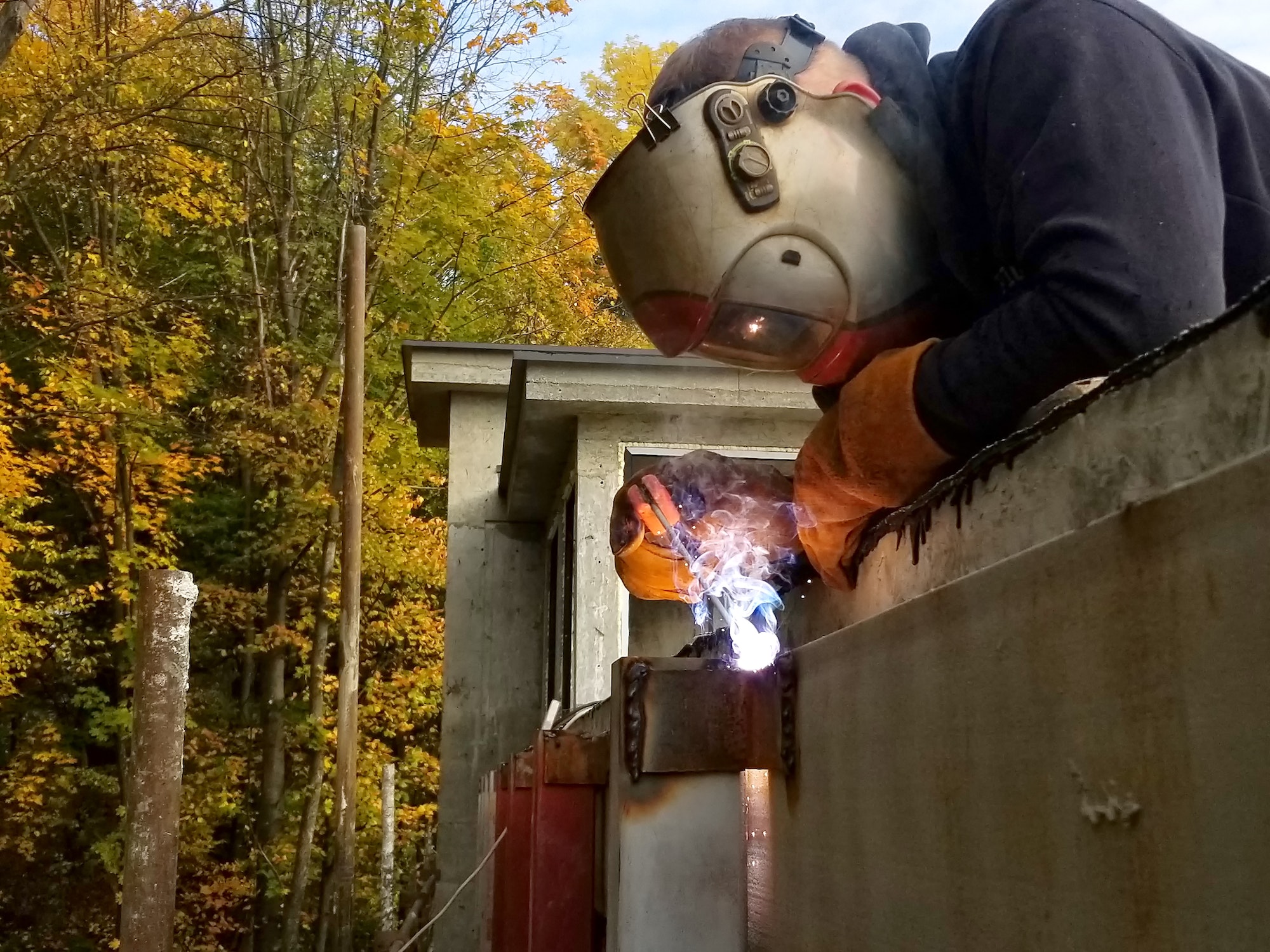 Worker welding in a factory. Welding on an industrial plant.